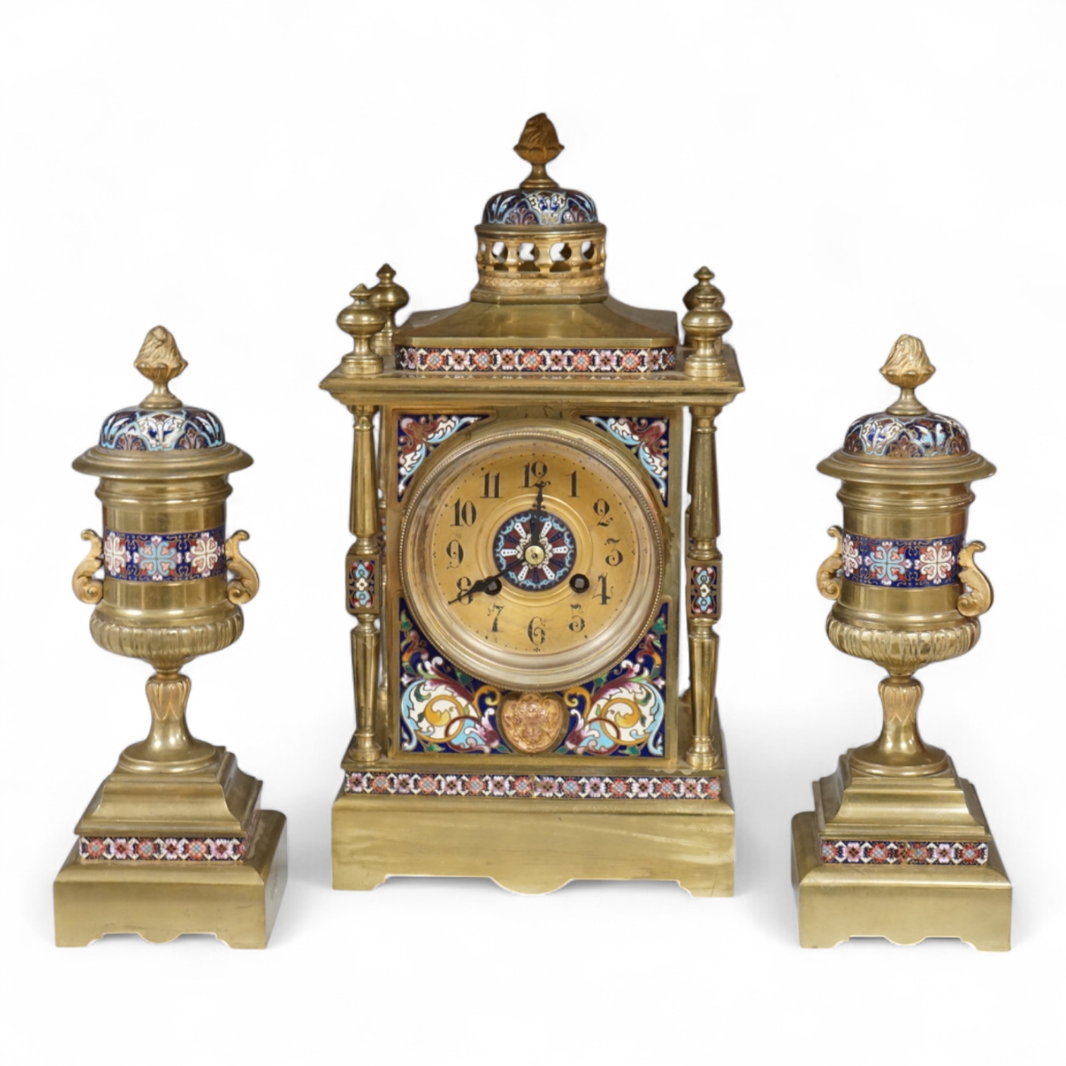A large early 20th century French brass and champlevé enamel clock garniture, 35cm high